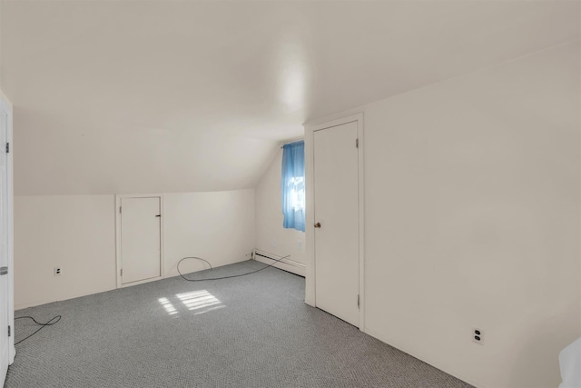 bonus room with baseboard heating, carpet, and vaulted ceiling