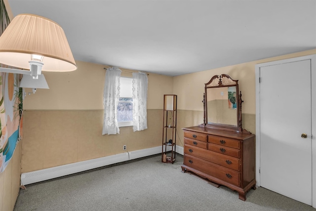bedroom featuring carpet flooring and baseboard heating