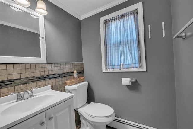 half bath featuring toilet, ornamental molding, plenty of natural light, a baseboard radiator, and vanity