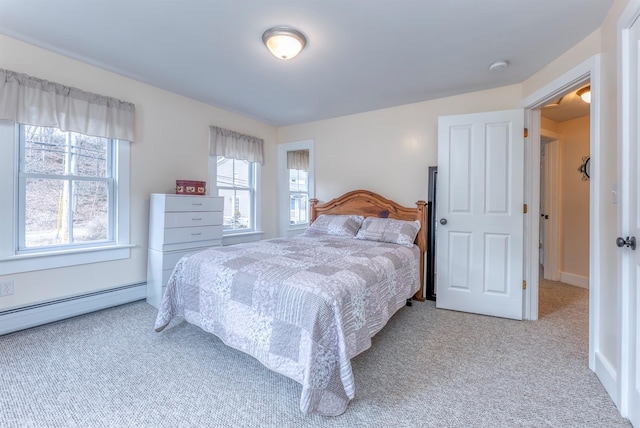 bedroom with carpet flooring and a baseboard radiator