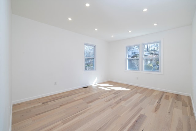 181 Vernon Valley Rd, East Northport, NY 11731 - empty room with healthy amount of natural light, recessed lighting, light wood-type flooring, and baseboards