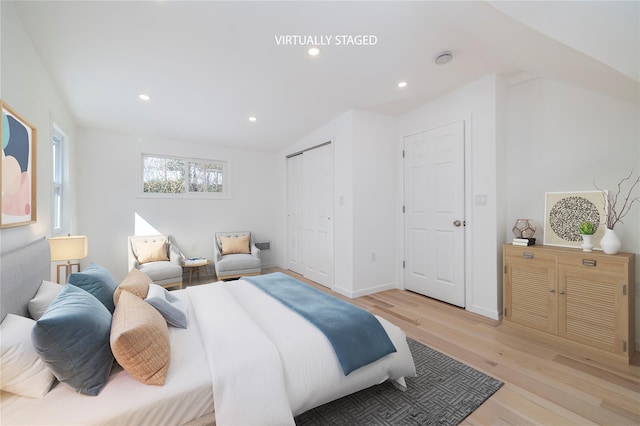 181 Vernon Valley Rd, East Northport, NY 11731 - bedroom featuring light wood finished floors, recessed lighting, baseboards, a closet, and vaulted ceiling