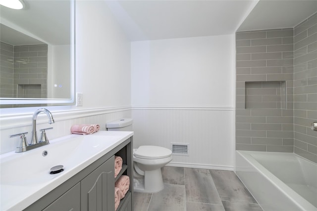 181 Vernon Valley Rd, East Northport, NY 11731 - bathroom featuring wood finished floors, wainscoting, toilet, and vanity