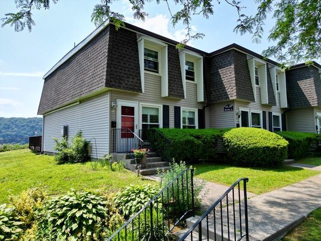 44 Hurlihe Unit 44, Poughkeepsie, NY 12601 - view of front of house with roof with shingles, mansard roof, and a front lawn