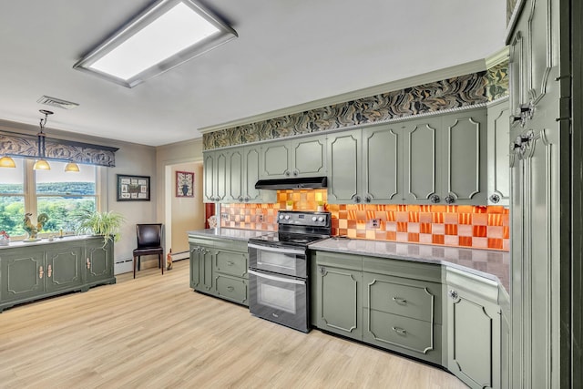 kitchen with decorative backsplash, range with two ovens, light wood-type flooring, green cabinets, and under cabinet range hood