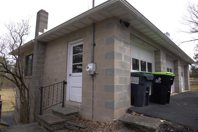 191 Gables Rd, Narrowsburg, NY 12764 - view of property exterior with concrete block siding and a chimney