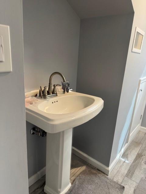 191 Gables Rd, Narrowsburg, NY 12764 - bathroom with wood finished floors, baseboards, and a sink