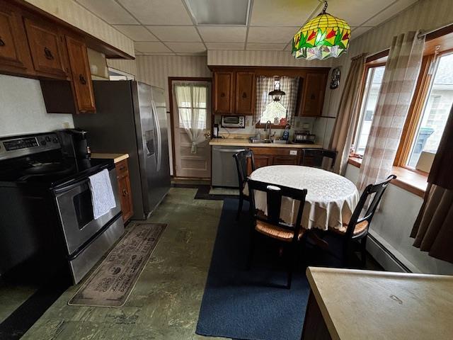 191 Gables Rd, Narrowsburg, NY 12764 - kitchen featuring stainless steel appliances, a sink, light countertops, a drop ceiling, and baseboard heating