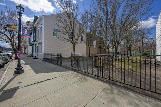 view of home's exterior featuring fence