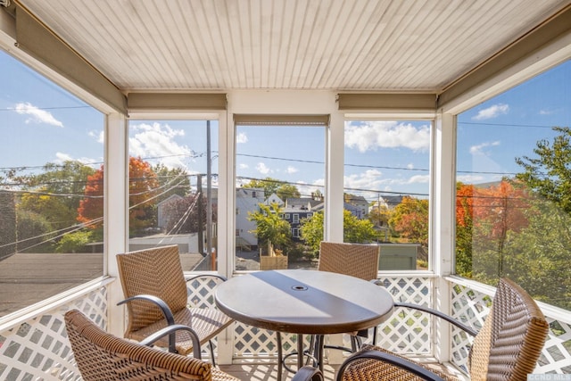 sunroom with outdoor dining space