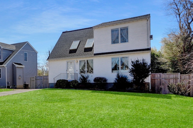 18 Saint George Dr, Shirley, NY 11967 - view of front facade featuring a gate, fence, and a front yard
