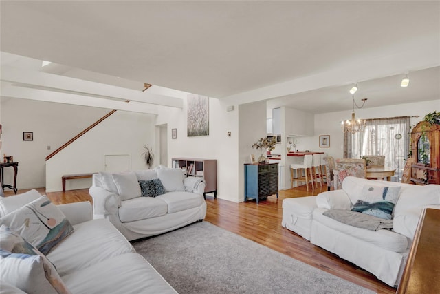 18 Saint George Dr, Shirley, NY 11967 - living area featuring wood finished floors and a chandelier