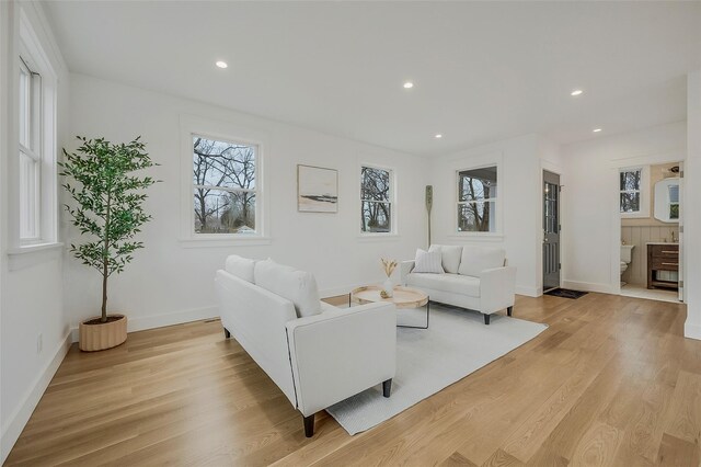 550 Madison Ave, Greenport, NY 11944 - living room featuring light wood finished floors, plenty of natural light, recessed lighting, and baseboards