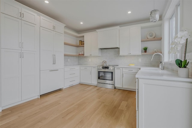 550 Madison Ave, Greenport, NY 11944 - kitchen featuring open shelves, electric range, a sink, light wood finished floors, and backsplash