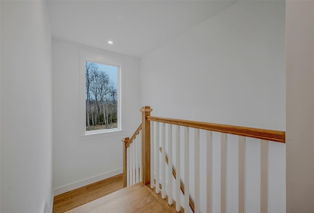 550 Madison Ave, Greenport, NY 11944 - stairs with wood finished floors, baseboards, and recessed lighting