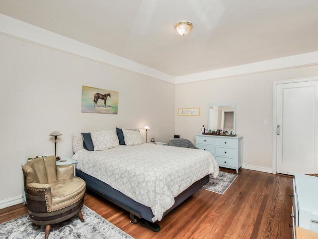 2166 Bronx Park E Unit 1G, Bronx, NY 10462 - bedroom with baseboards and dark wood-style flooring