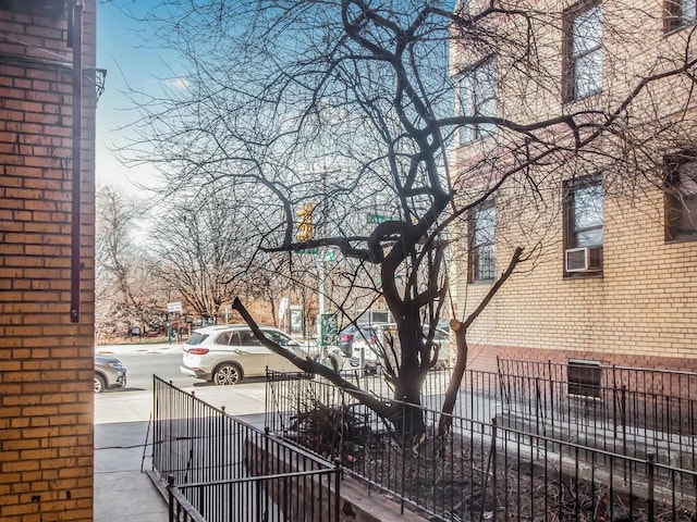 2166 Bronx Park E Unit 1G, Bronx, NY 10462 - view of side of property with brick siding and fence