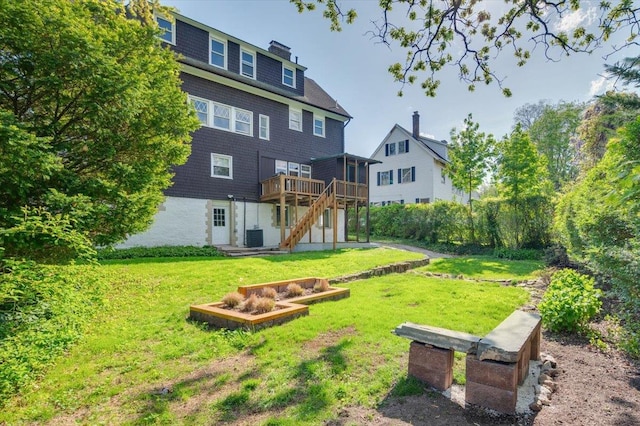 back of house featuring a lawn, cooling unit, a wooden deck, and stairs