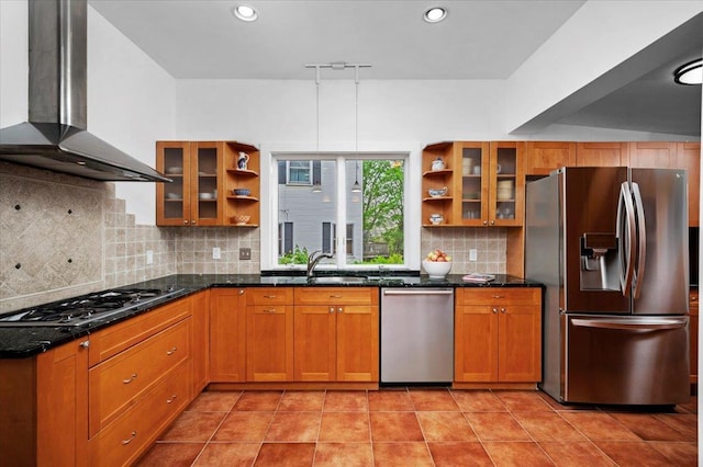 kitchen featuring wall chimney range hood, stainless steel appliances, open shelves, and a sink