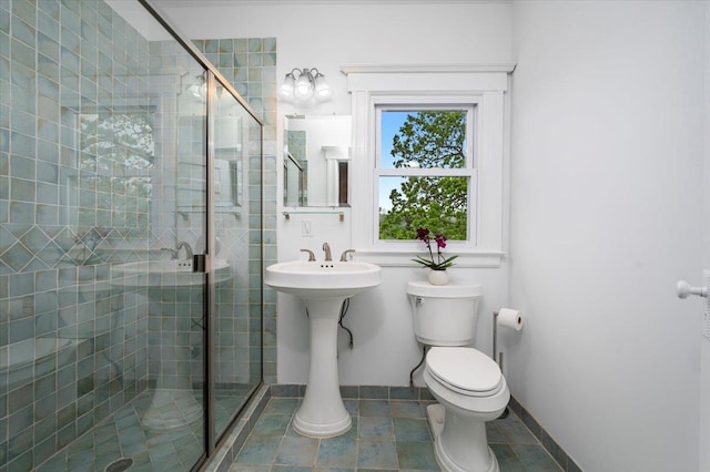 bathroom with toilet and a stall shower