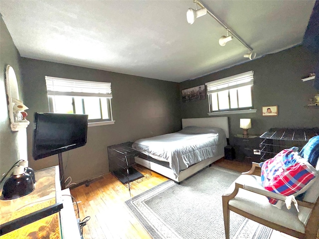 15 Highland Ave, Chestnut Ridge, NY 10977 - bedroom with rail lighting and wood finished floors