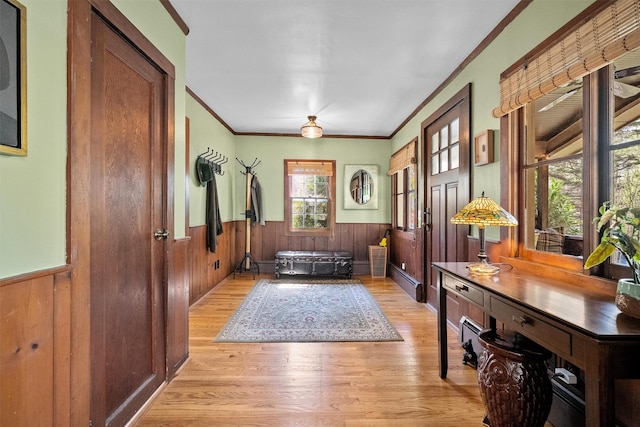 35 Riverview Trl, Croton-On-Hudson, NY 10520 - entryway with a wainscoted wall, light wood finished floors, crown molding, and wood walls