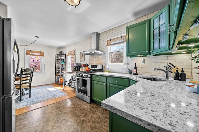 35 Riverview Trl, Croton-On-Hudson, NY 10520 - kitchen featuring green cabinets, stainless steel range with gas stovetop, wall chimney range hood, and healthy amount of natural light