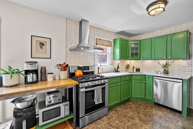 35 Riverview Trl, Croton-On-Hudson, NY 10520 - kitchen with stainless steel appliances, wall chimney range hood, backsplash, and green cabinets