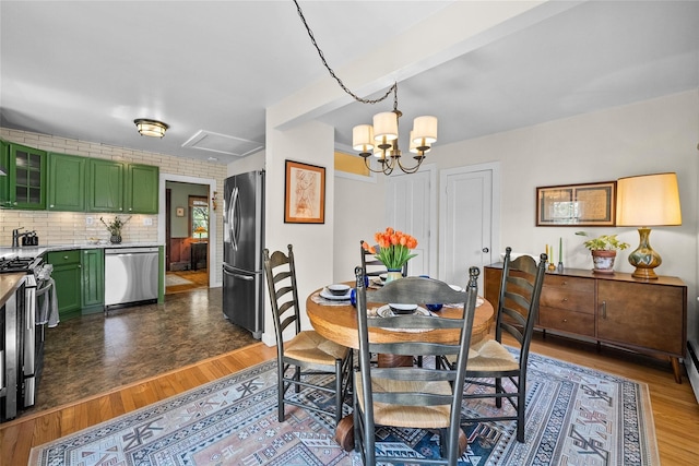 35 Riverview Trl, Croton-On-Hudson, NY 10520 - dining room featuring a chandelier and wood finished floors