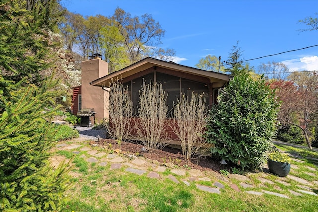 35 Riverview Trl, Croton-On-Hudson, NY 10520 - view of side of property featuring a chimney and a sunroom