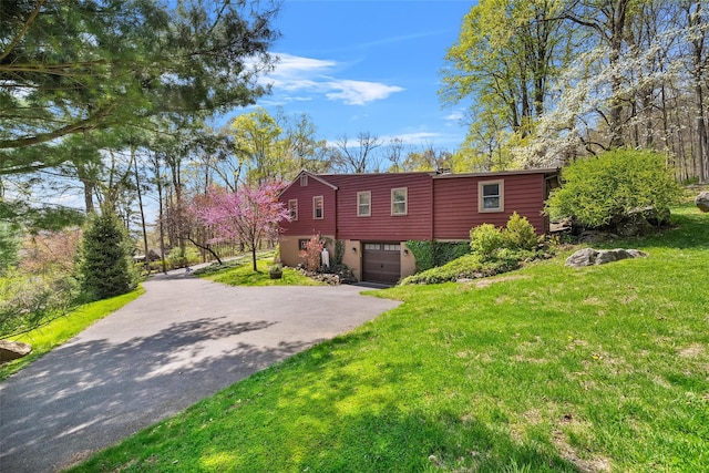 35 Riverview Trl, Croton-On-Hudson, NY 10520 - view of front of home with driveway, a garage, and a front lawn