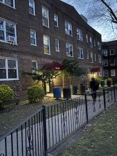141-35 78th Rd Unit 3M, Kew Garden Hills, NY 11367 - view of home's community featuring fence