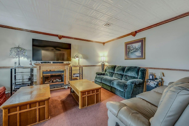 carpeted living room featuring visible vents, ornamental molding, and a glass covered fireplace