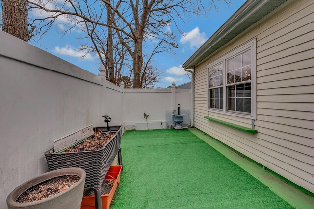 view of patio featuring a fenced backyard and a vegetable garden