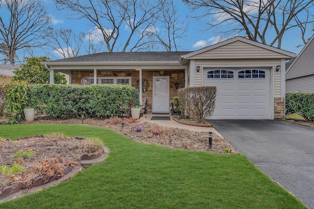 ranch-style home with driveway, a front yard, stone siding, and a garage