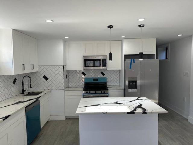 3425 Boller Ave, Bronx, NY 10475 - kitchen with white cabinetry, a sink, stainless steel appliances, and light stone counters