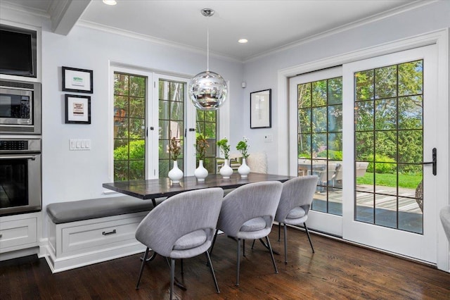 dining area with recessed lighting, ornamental molding, and dark wood-style flooring