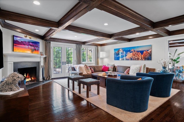 living room with french doors, a lit fireplace, wood finished floors, beamed ceiling, and coffered ceiling