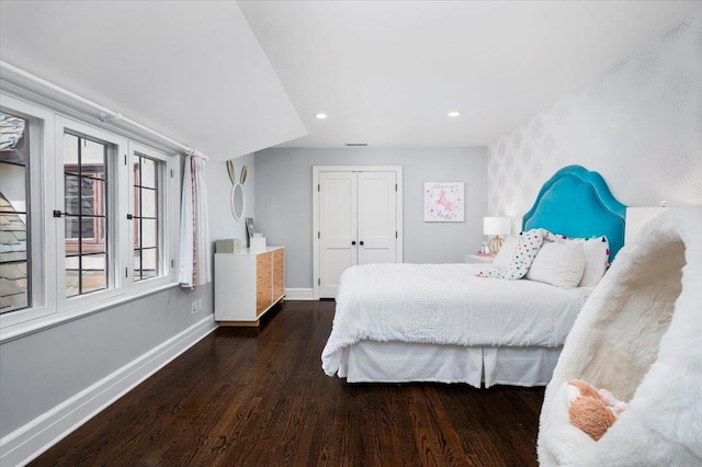 bedroom with baseboards, multiple windows, recessed lighting, and wood finished floors