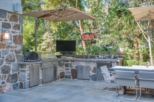 view of patio / terrace featuring outdoor dining area, a grill, a sink, and area for grilling