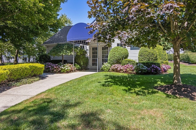 view of yard with french doors