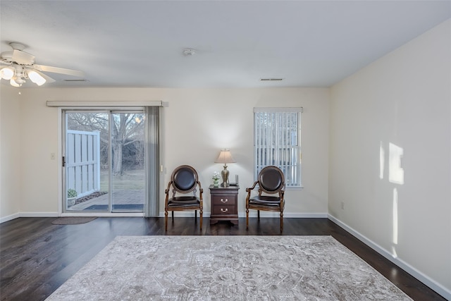 903 Sara Cir Unit 903, Port Jefferson Station, NY 11776 - living area with dark wood-style flooring, baseboards, and a ceiling fan