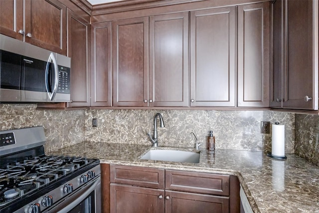 903 Sara Cir Unit 903, Port Jefferson Station, NY 11776 - kitchen with appliances with stainless steel finishes, a sink, tasteful backsplash, and stone countertops