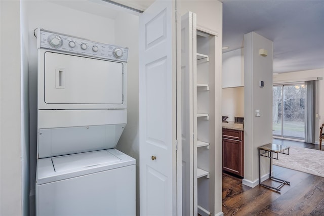 903 Sara Cir Unit 903, Port Jefferson Station, NY 11776 - laundry area with estacked washer and dryer and dark wood-style flooring