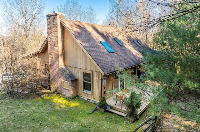 79 Torre Rock Rd, Red Hook, NY 12571 - view of side of home featuring a shingled roof, a chimney, a lawn, and a wooden deck