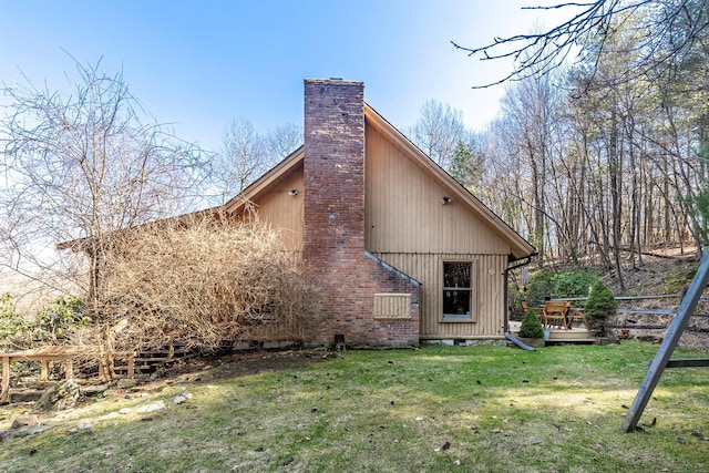 79 Torre Rock Rd, Red Hook, NY 12571 - back of property featuring a chimney, a yard, and a deck