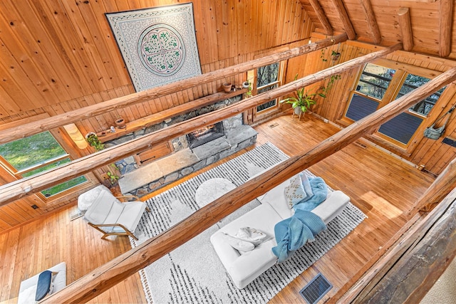 79 Torre Rock Rd, Red Hook, NY 12571 - living room featuring wood walls, wood-type flooring, healthy amount of natural light, and wooden ceiling