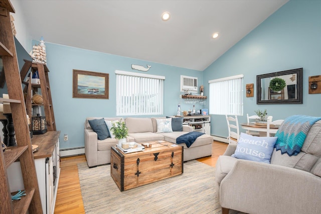 720 W Park Ave, Long Beach, NY 11561 - living room featuring baseboard heating, a wall mounted AC, light wood finished floors, and recessed lighting