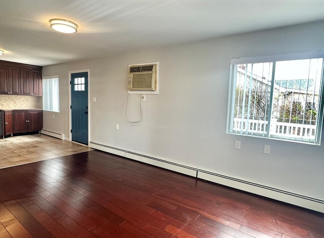 720 W Park Ave, Long Beach, NY 11561 - entrance foyer with light wood-style flooring, a wall mounted AC, and baseboard heating
