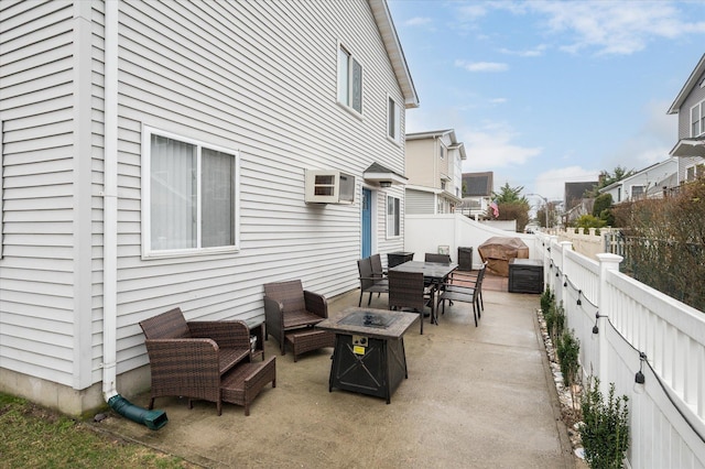 720 W Park Ave, Long Beach, NY 11561 - view of patio / terrace with outdoor dining space, a residential view, a fire pit, and a fenced backyard
